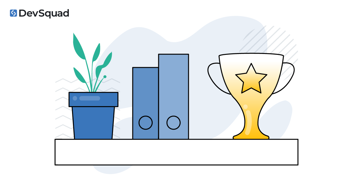 Plant, books, and a trophy on a shelf